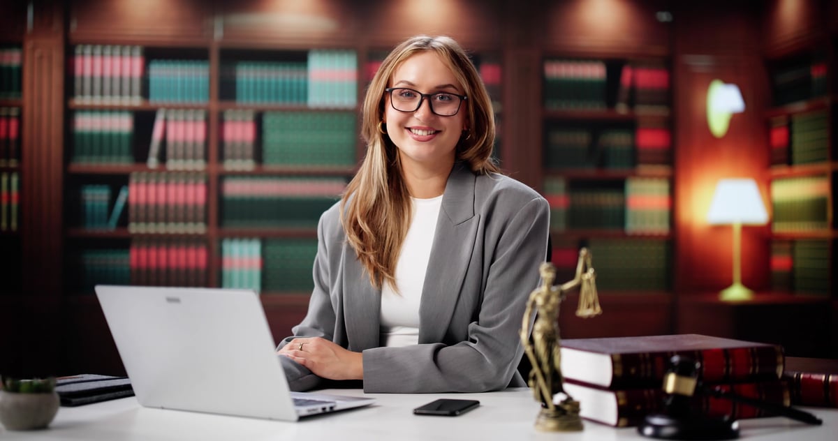 The Young Lawyer's Confident Portrait In Front Of Bookshelfprofile